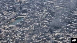 Orașul Gaza City este parțial distrus de bombardamentele israeliene.