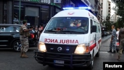 People gather outside a hospital in Beirut after thousands of people were wounded across Lebanon when their handheld pagers exploded on September 17.