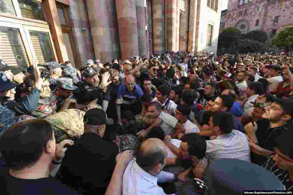 People rally outside the Armenian government building to protest against Pashinian in Yerevan on September 19. Pashinian, who was blamed by nationalists and other critics for losses in the 2020 fighting, noted the cease-fire but immediately&nbsp;distanced his government from its terms. &nbsp;