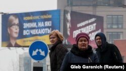 Агітаційні плакати Тимошенко та Порошенка