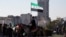 Syria - A man holding a flag adopted by Syria's new rulers rides a horse, after Syria's Bashar al-Assad was ousted, in central Damascus, December 15, 2024. 