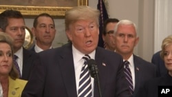 U.S. President Donald Trump speaks about canceling summit with North Korea's Kim Jong Un, with Vice President Mike Pence in the background (right).