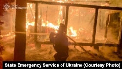The aftermath of a Russian attack in Ukraine's Kharkiv region on October 12
