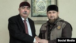 Afghan First Vice President Abdul Rashid Dostum (left) meets with Chechnya's Ramzan Kadyrov in Grozny on October 5.