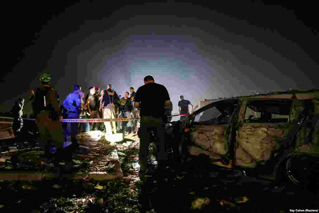 Spasioci i zaštitari na lokaciji koju je napao Iran, u Zavdielu, 15. juna.