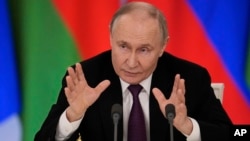 ولسمشر پوتین د مارچ پر ۱۳مه په مسکو کې د خبري غونډې پر مهال یوه پوښتنه ځوابوي.