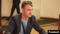 His lawyer says Igor Khoroshilov has the right to immunity during the election season as a member of the election committee, and that he was illegally denied access after his client's arrest.