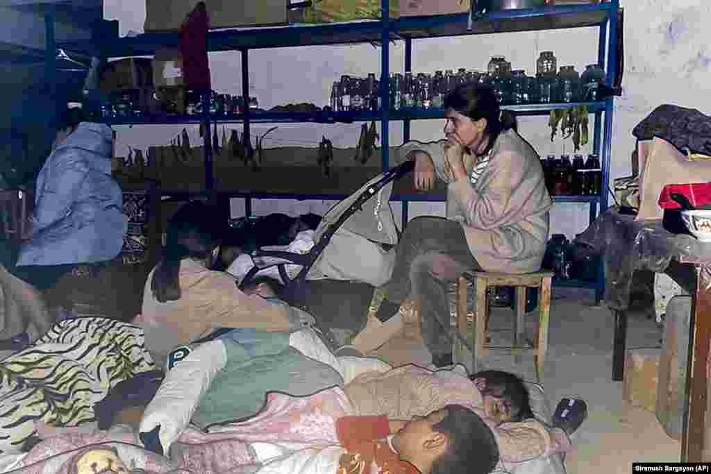 Children sleep in a shelter during shelling in Stepanakert. Azerbaijan&rsquo;s Defense Ministry said on September 19 that "only legitimate military targets are being destroyed," and the Foreign Ministry said the only path to peace in the region was the complete withdrawal of Armenian forces from the territory. &nbsp;