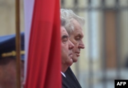 Tajik President Emomali Rahmon (left) with his Czech counterpart, Milos Zeman, during a visit to Prague on December 1.