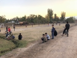 Young spectators at a soccer game in the village of Budiyon.