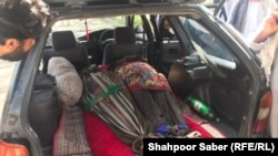 Dead bodies of the Afghans who were allegedly forced by the Iranian border guards to jump into a river.