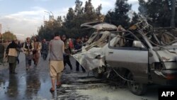 The remains of a minivan after one of two bombings in Kabul claimed by the local affiliate of Islamic State 