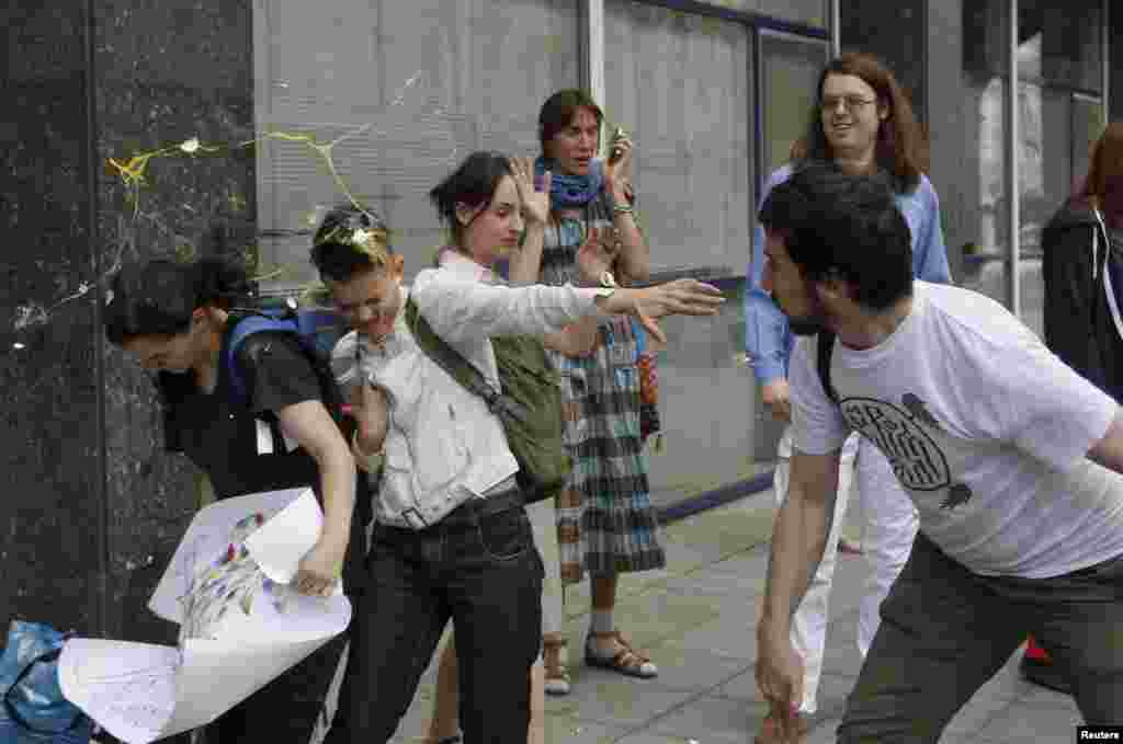 An egg splatters over young gay-rights activists after an attempted "kiss-in" in front of the Russian parliament in Moscow in 2013. Vladimir Putin himself has maintained a publicly benign attitude to Russia's LGBT community and has repeatedly claimed Russia does not discriminate against gays.&nbsp;