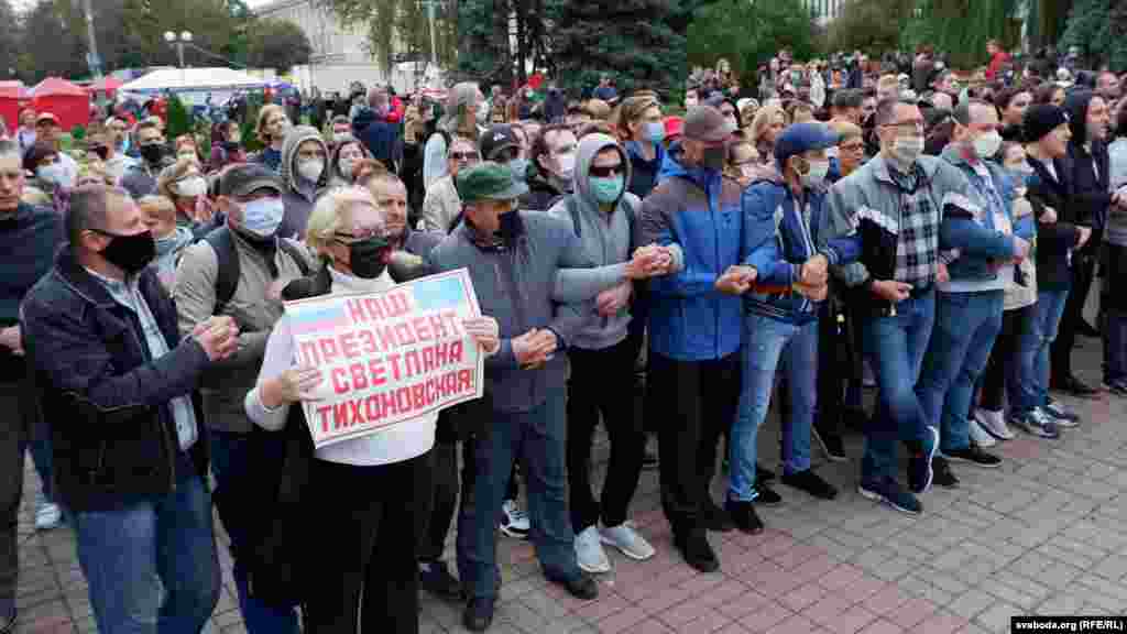 A protester in Homel holds a sign that reads, "Our president is Svyatlana Tsikhanouskaya."