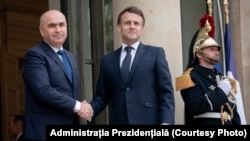 Președintele interimar al României, Ilie Bolojan, și președintele Franței, Emmanuel Macron, la prima întâlnire pe teme de securitate europeană, cea din 19 februarie 2025.