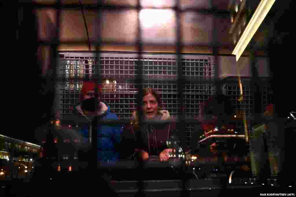 Detainees are held in a police van in downtown Moscow on February 2.