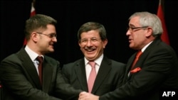 Turkish Foreign Minister Ahmet Davutoglu (center) brought together his Serbian and Bosnian counterparts, Vuk Jeremic (left) and Sven Alkalaj at a meeting in Ankara in February. 