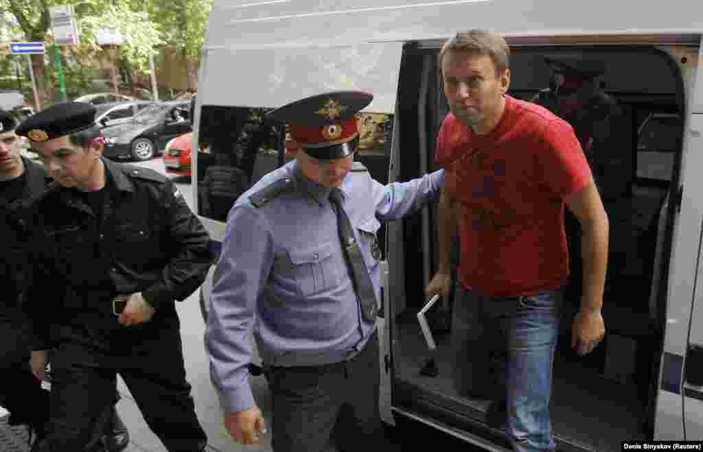 Navalny is escorted to a court session in Moscow in May 2012. He was detained during an opposition rally a day after the May 7 inauguration of Putin. Navalny was sentenced to another 15 days of jail for "participating in an illegal public event."