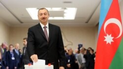 President Ilham Aliyev casts his ballot at a polling station in Baku.