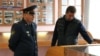 Dmitry Nikolayev (left) is being investigated in cases involving torture.