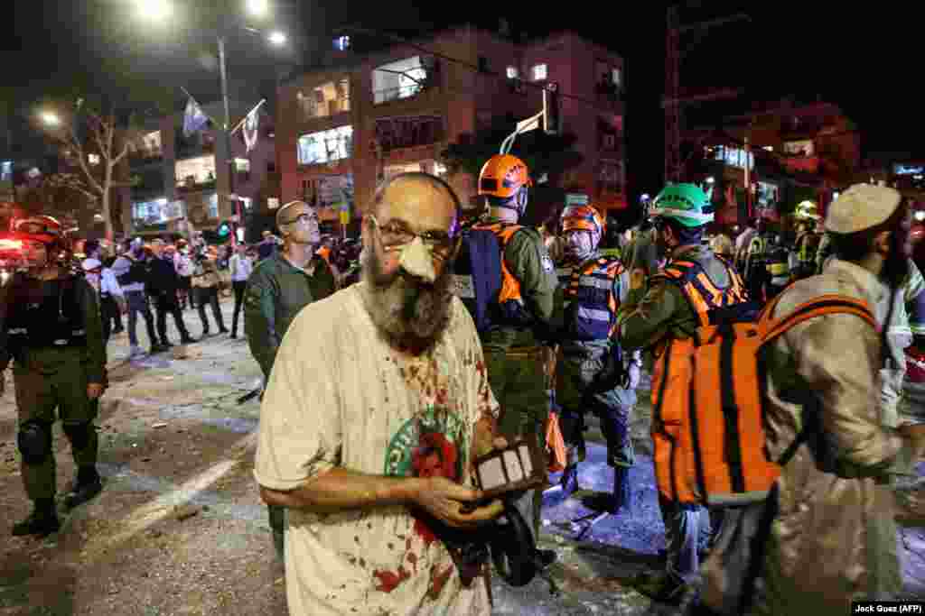 11. 13 ივნისი: დაშავებული კაცი რამათ-განში ისრაელზე ირანის დარტყმების შემდეგ.