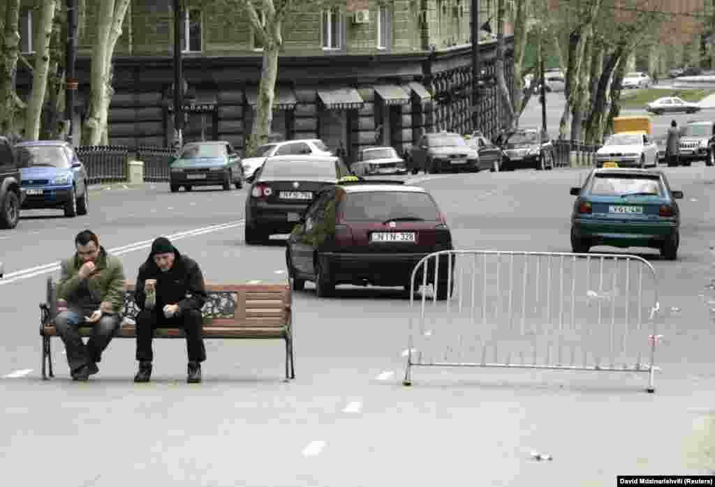 Demonstrators man a makeshift roadblock on Rustaveli Avenue during anti-government protests in 2009.&nbsp; In 2008, Georgian writer Guram Odisharia predicted that, "without a harmonic relationship between the authorities and society, the people&rsquo;s hopes will always be deceived and the main player in our country&rsquo;s political history will be Rustaveli Avenue, and not Georgian politicians.&rdquo;&nbsp;