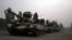 FILE: Pakistani army tanks form a column during a ground military operation against Taliban militants in the main town of Miran Shah in North Waziristan, in June 2014.