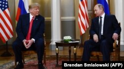 Russian President Vladimir Putin (right) and U.S. President Donald Trump (left) attend a meeting in Helsinki in July 2018.