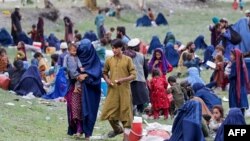 Afghan women and children take refuge after fleeing their homes in the aftermath of an earthquake in Kunar Province on September 3.