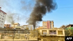 Smoke rises up from the site of explosions in Kabul on October 15.
