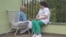A nurse talks to a patient at the Casa Sperantei medical facility in Bucharest.