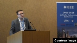 Ion, ținând un discurs la Vehicular Networking Conference, în 2019.