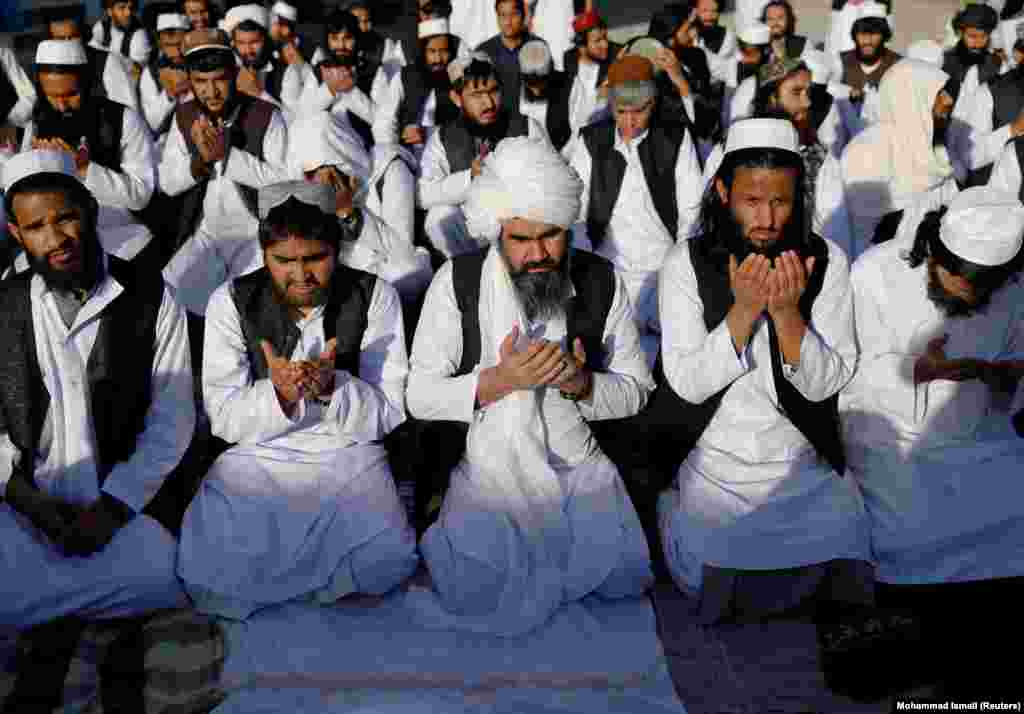 Some of the 900 Taliban prisoners pray on May 26 after being released from&nbsp;Pul-e-Charkhi prison, Afghanistan's largest detention facility.