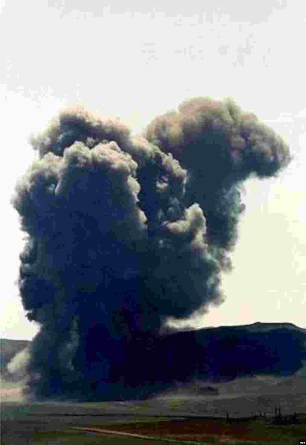 A giant cloud of black smoke arises as Kazakhstan's last nuclear weapons test site is put out of action with a bang in July 2000. The former Soviet republic blew up the sole remaining test tunnel at Semipalatinsk with 90 tons of explosives.