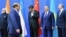 Pakistani Prime Minister Nawaz Sharif (second from left) walks past (left to right) Indian Prime Minister Narendra Modi, Chinese President Xi Jinping, Kazakh President Nursultan Nazarbaev, and Russian President Vladimir Putin as he arrives for group photo at the Shanghai Cooperation Council summit in Astana on June 9.
