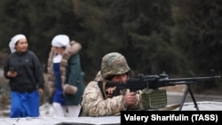 Kazakhstan --An Armenian CSTO peacekeeper guards Aksai Bakery in Almaty, January 11, 2022.
