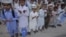 Pakistan -- Students of a madrasa (religious school) pray before going into a classroom at Karachi's Memon Mosque, 24Jun2012