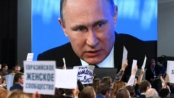 Russian President Vladimir Putin's 12th annual press conference was staged in front of around 1,500 selected journalists in Moscow, many of whom wave signs to try to get their questions addressed.