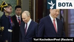 Russian President Vladimir Putin and Chinese President Xi Jinping attend a meeting at the Kremlin in Moscow in May.