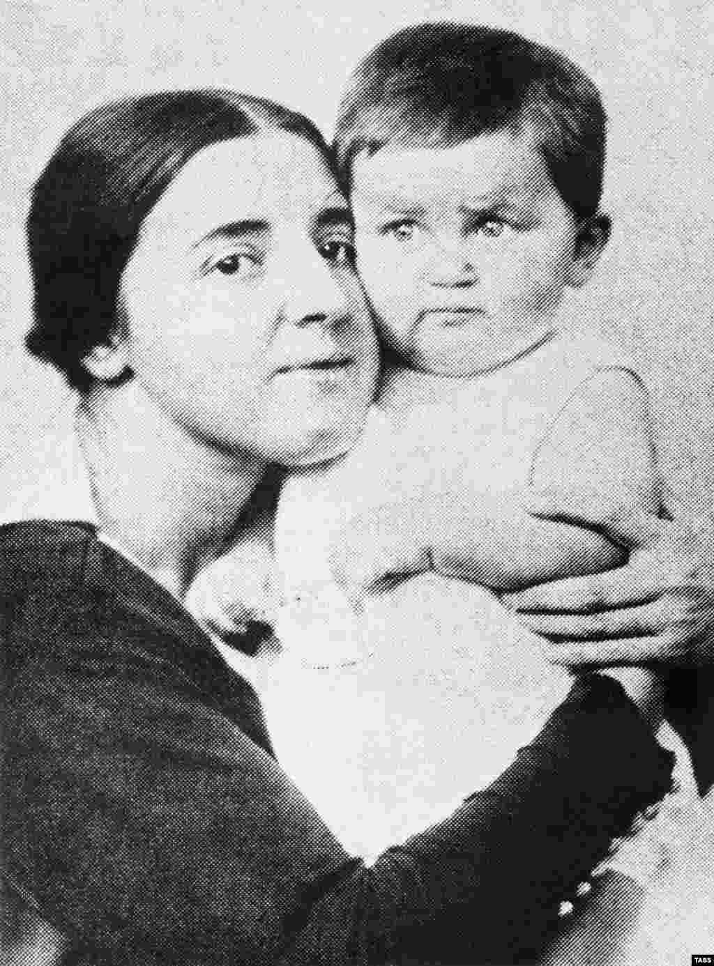 Nadezhda Alliluyeva, Josef Stalin's second wife, shown here with their son, Vasily, in 1922. The daughter of a revolutionary railroad worker, Alliluyeva met Stalin while he hid in her family's house in 1911. They married in 1919, when Stalin was 41 and Nadezhda was 18. Nadezhda died in 1932, officially of appendicitis. Some believe she committed suicide, while others contend that Stalin killed her. Vasily was born in 1921. He was a Soviet pilot during World War II and was made a general after the war. After Stalin died, Vasily was sentenced to eight years in prison. He was released in 1960. He was allowed to wear his uniform and medals. He died of alcholism in 1962 and was partially rehabilitated in 1999.