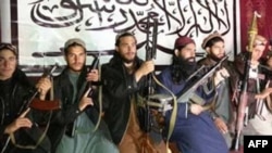 A photo taken at an undisclosed location, released by Tehrik-e-Taliban Pakistan (TTP) and received in December 2014, shows fighters who allegedly stormed an army-run school in Peshawar.