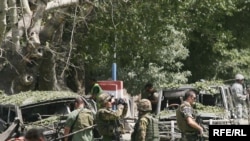 NATO soldiers secure the site of the attack on August 15