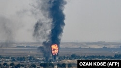 Сириянын Рас-аль-Айн шаарынан чыккан түтүн. 17-октябрь, 2019-жыл. 