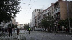 Survivors Of Russia's Attack On Kyiv Sort Through Aftermath