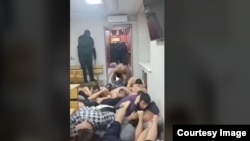 Мончодогу сабалган мигранттардын окуясы тартылган видеодон алынган сүрөт.