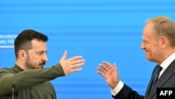 Președintele ucrainean Volodimir Zelenski și premierul polonez Donald Tusk.