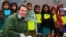 Author Greg Mortenson with Pakistani schoolchildren