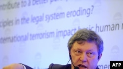 Grigory Yavlinsky gestures as he delivers a speech during the 15th Forum 2000 Conference in Prague on October 10.