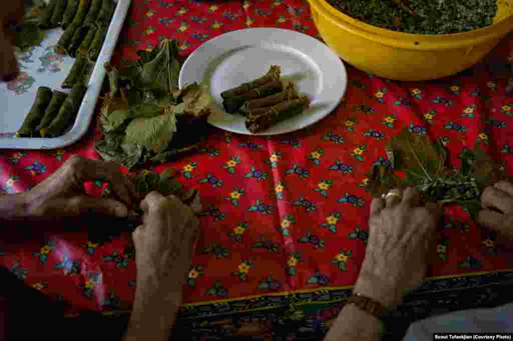 Rolling dolma, the classic stuffed grape leaves, in Paris. "When I meet an Armenian, it's like we have been friends forever," says one Armenian living in France. "And that, I do not feel it with anyone else. The connection is there right away, due to our ancestors and history."&nbsp; &nbsp;