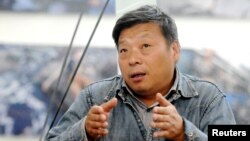 Кытайлык сүрөтчү Лу Гуан. 20-сентябрь, 2014-жыл. 